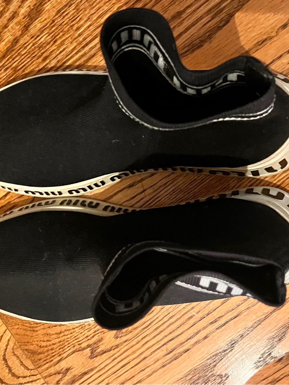 Miu Miu Black Slip-On Knit Loafers with White Logo Trim